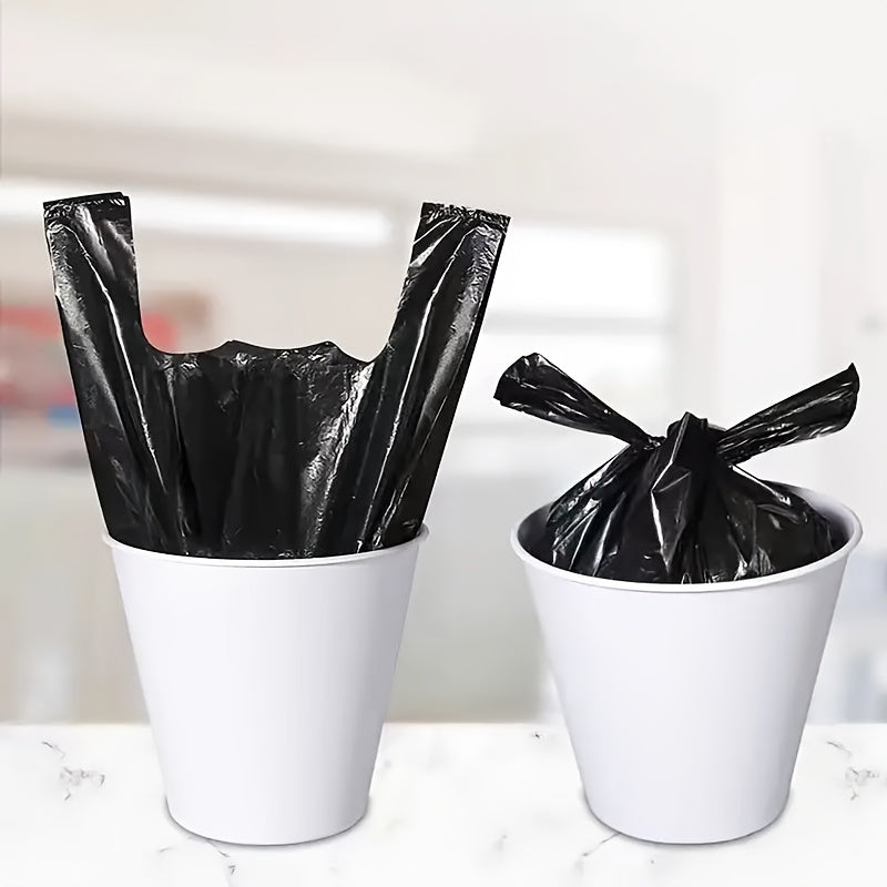 Black Disposable Garbage Bags, 100-200 pieces per pack. These thickened solid color handheld plastic bags measure 32.0cm by 51.0cm and are perfect for use in the home, kitchen, office, hotel, and commercial spaces. Also suitable for outdoor use in the