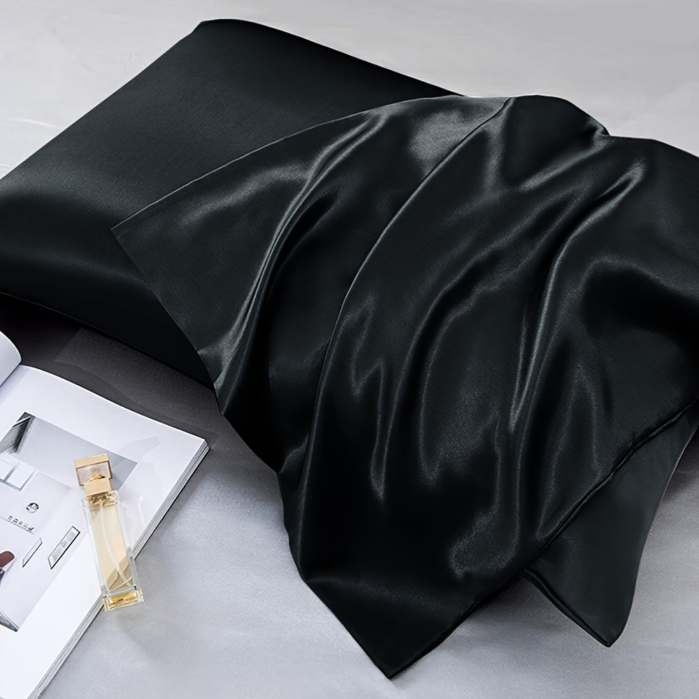 Two-pack of luxurious silky satin pillowcases, made from ultra soft smooth polyester with an envelope closure design. Available in solid colors, these machine washable pillow covers are lightweight at 80-85gsm, providing cooling comfort for hair and