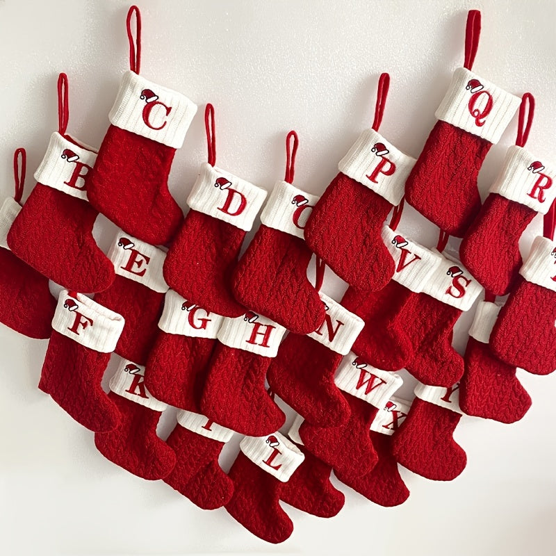 11" Christmas stocking with knitted alphabet design, perfect for hanging on the Xmas tree or using as a gift bag. Made of polyester.