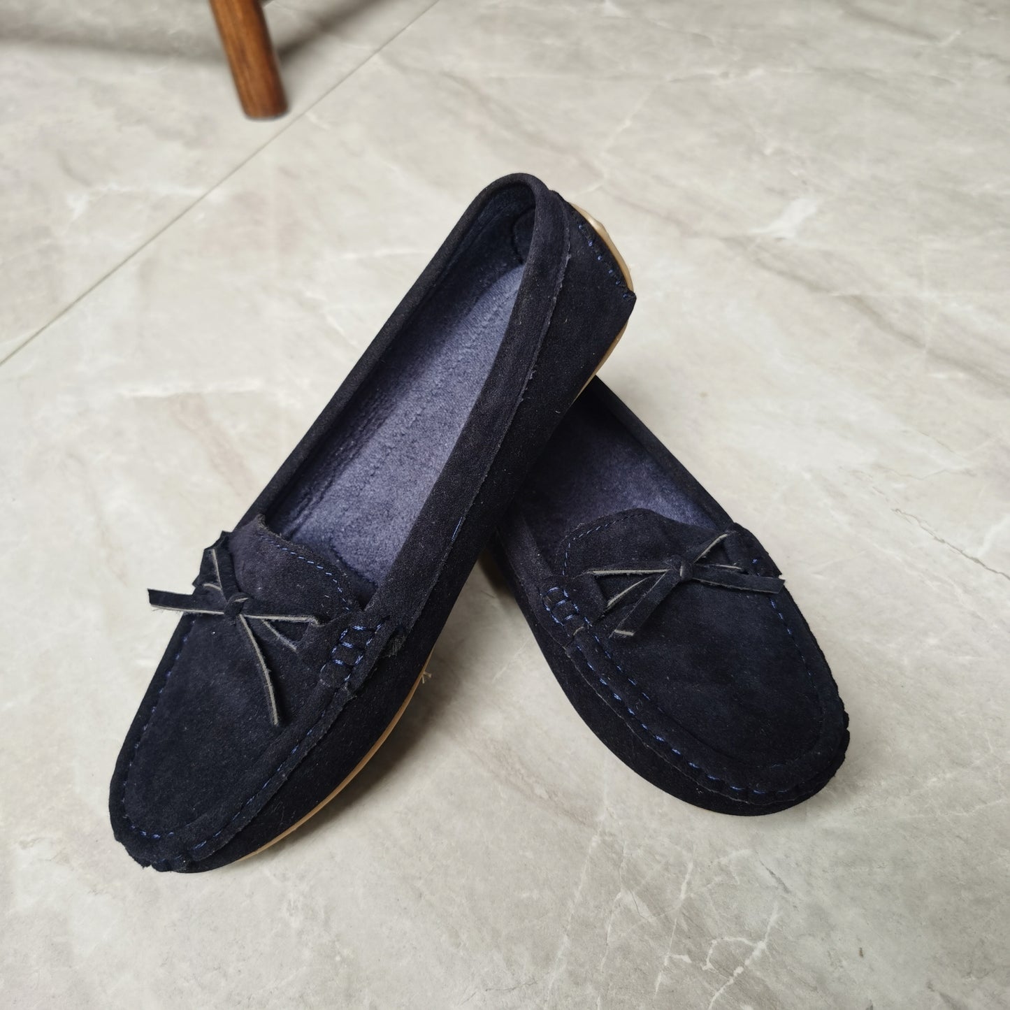 Retro flat loafers with bow detail, slip on style, and soft sole for casual wear.