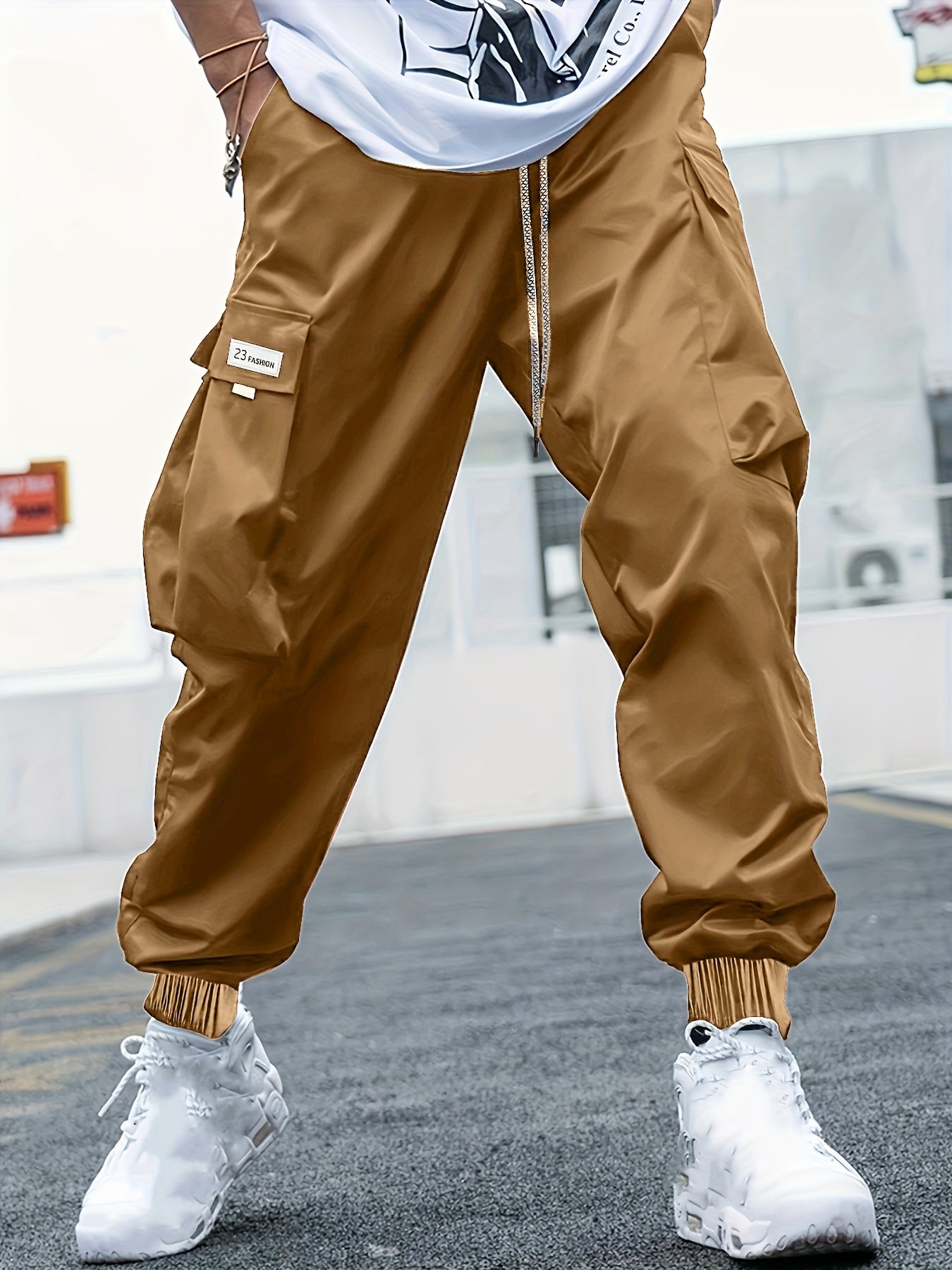 Men's plus-size cargo pants with letters print, multiple pockets, ideal for outdoor activities.