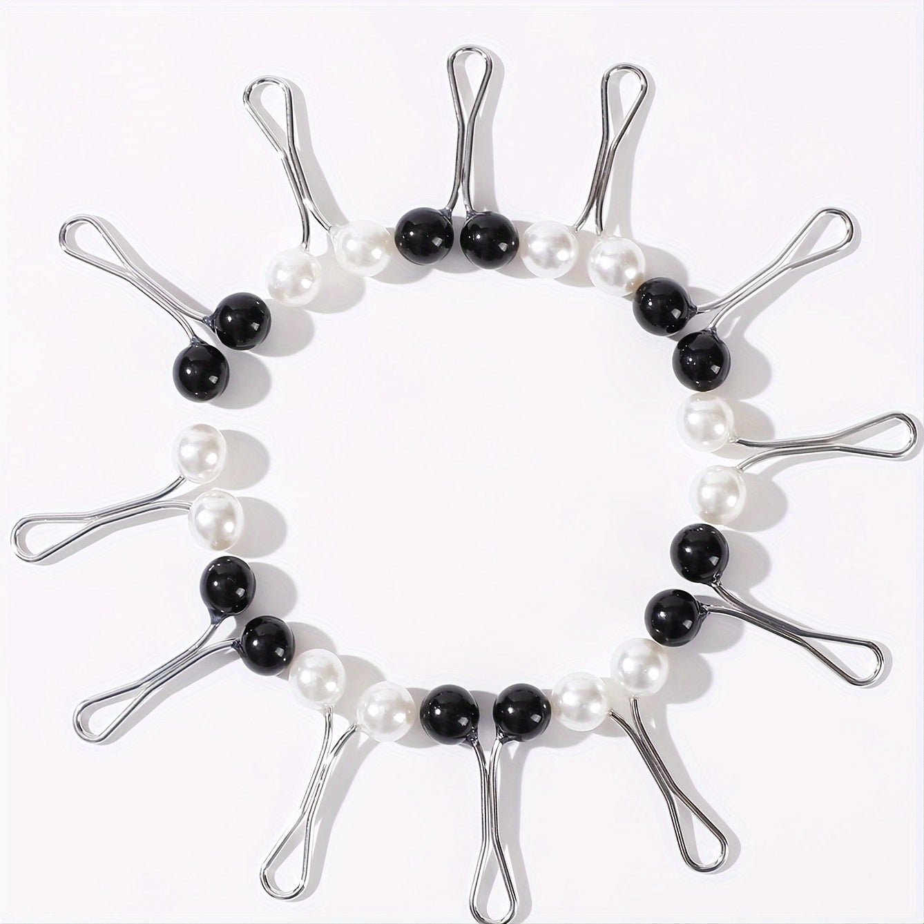 12 Middle Eastern headscarf clips with faux pearl brooches for securing silky scarves and shawls.