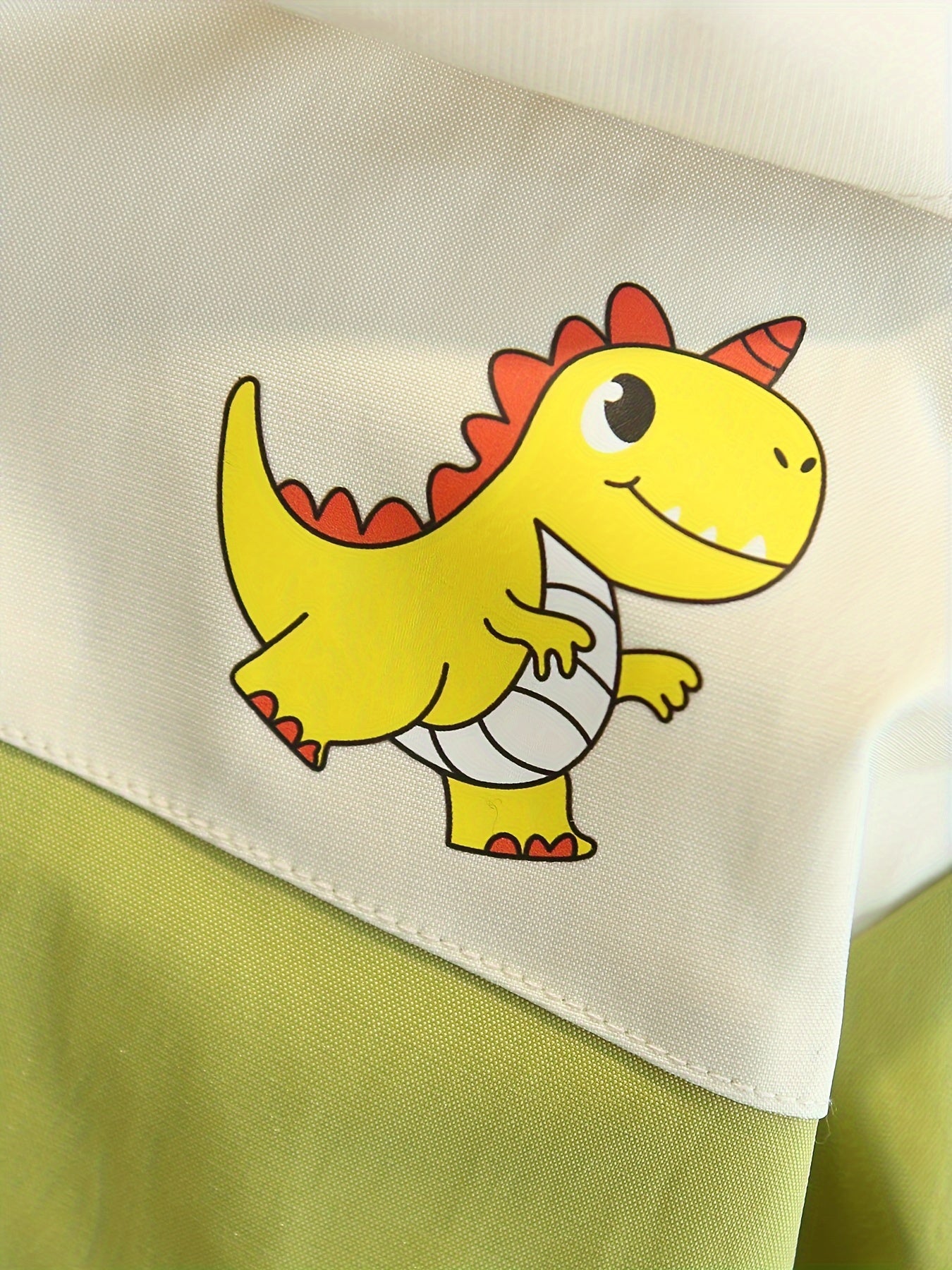 Boys' stylish zip-up dinosaur hoodie for cozy spring and autumn wear.