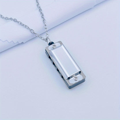 Necklace harmonica with four holes and eight tones for playing songs.