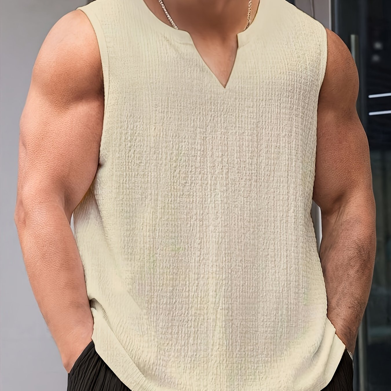 Polyester tank top for men with loose fit and slight stretch, perfect for casual summer outings.