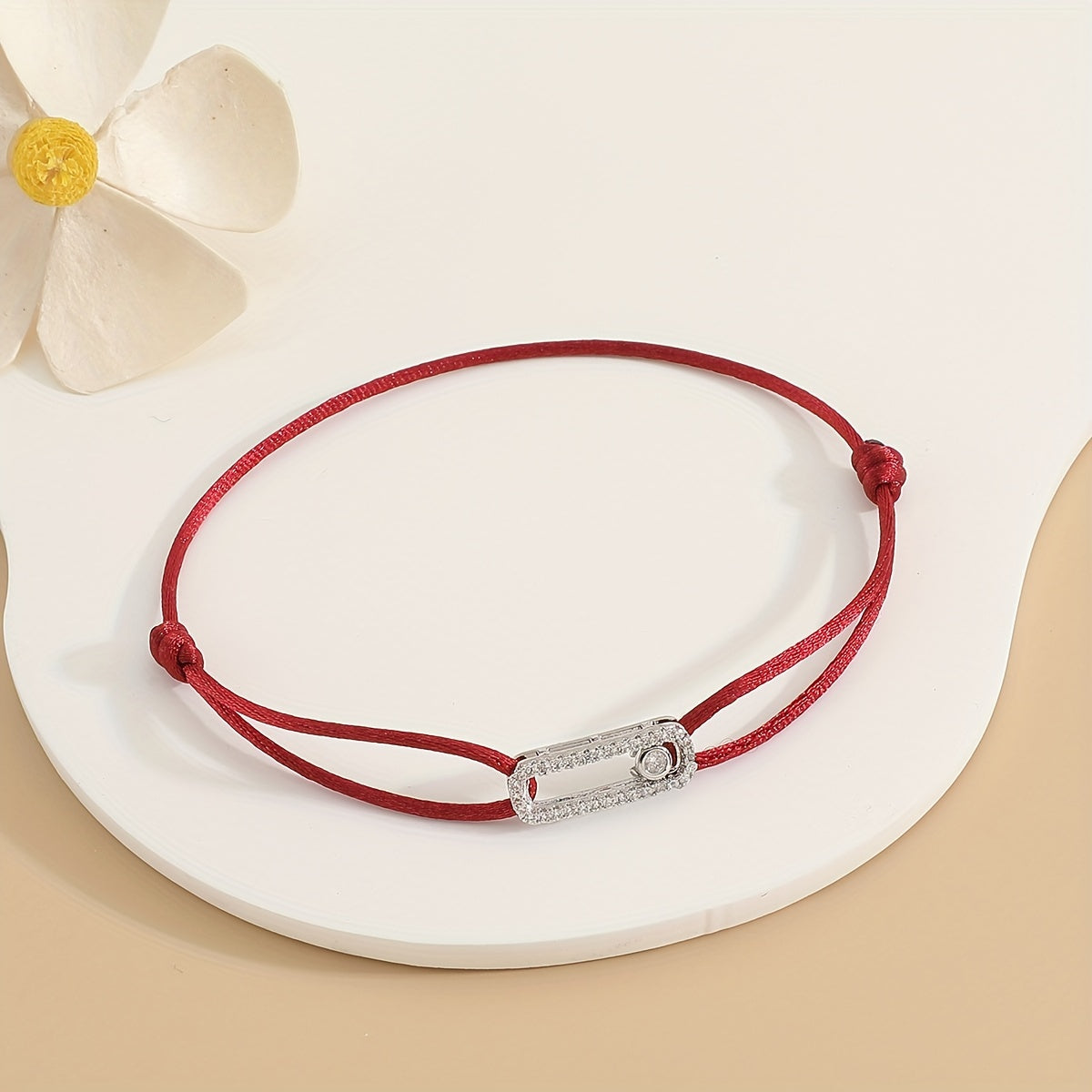 A stylish and timeless charm bracelet designed for women, featuring adjustable sizing and movable zirconia accents. This premium accessory is the perfect gift for any fashionable woman who appreciates high-quality jewelry.