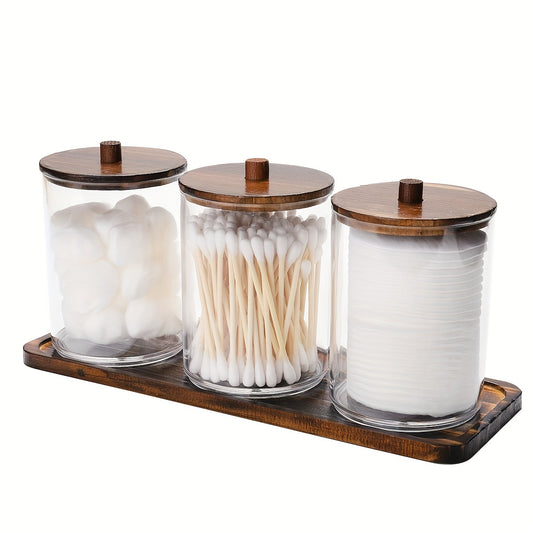 Vintage-inspired 3-piece clear plastic holder set with rustic wooden tray, perfect for bathroom storage. Ideal for displaying swabs and pads, and organizing home items.