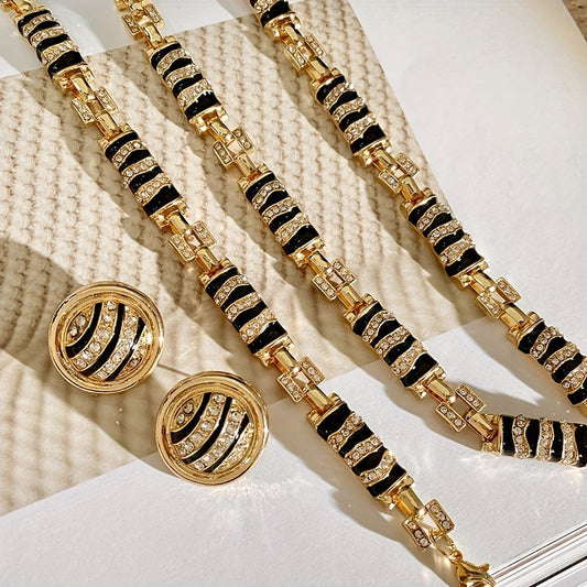 Chic and Stylish French-Inspired Zebra Print Jewelry Set - Featuring Vintage Geometric Design in Gold Plated Enamel with Sparkling Rhinestone Details. Complete with Necklace, Bracelet, and Earrings; Ideal for Everyday Wear, Events, and Celebrations.