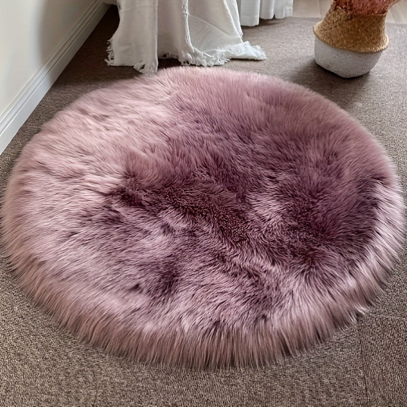 Round luxury area rug made from soft faux fur material with high pile and knit weave, machine washable, lightweight and fluffy. Crafted from a blend of polyester and acrylic in a solid color design. Perfect for adding a cozy touch to bedroom, living