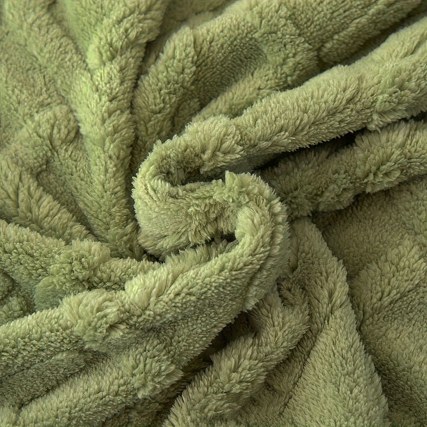 Stay cozy all year round with the July Casa Ultra-Soft Jacquard Velvet Blanket. This thick, reversible throw is perfect for any season and is machine washable for easy cleaning. Available in a beautiful green color.