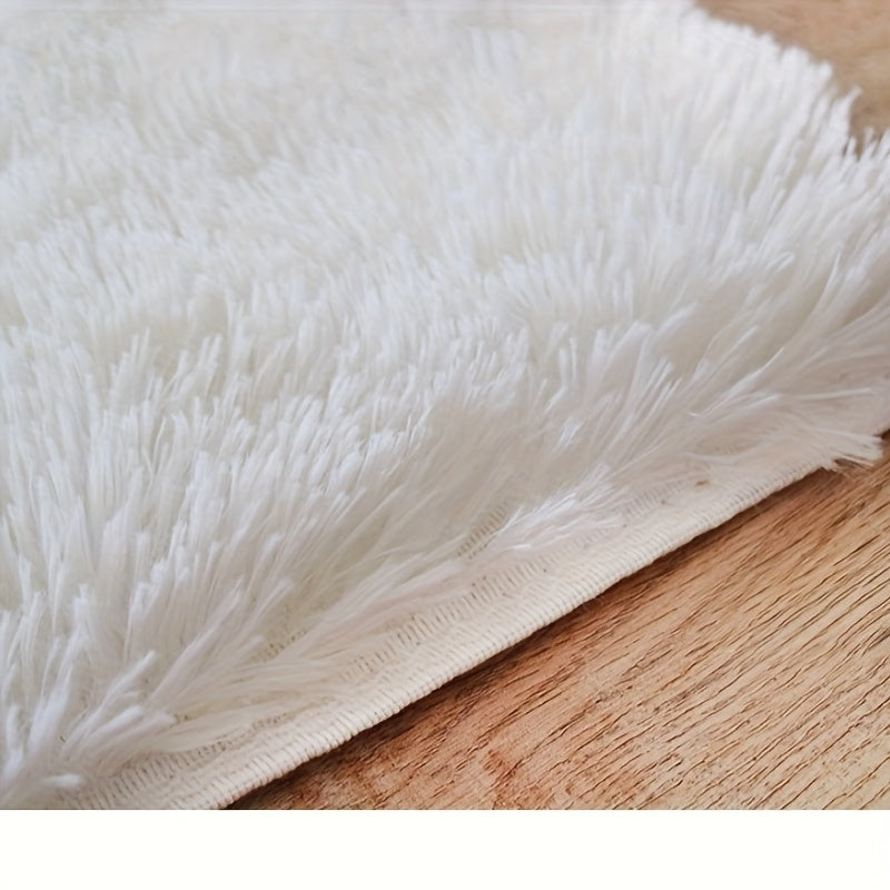 Soft and luxurious light gray plush floor mat with non-slip backing for ultimate comfort and safety. Made of ultra soft, fluffy polyester, this mat is perfect for use in the bedroom, bathroom, or living room. It is machine washable, making it easy to