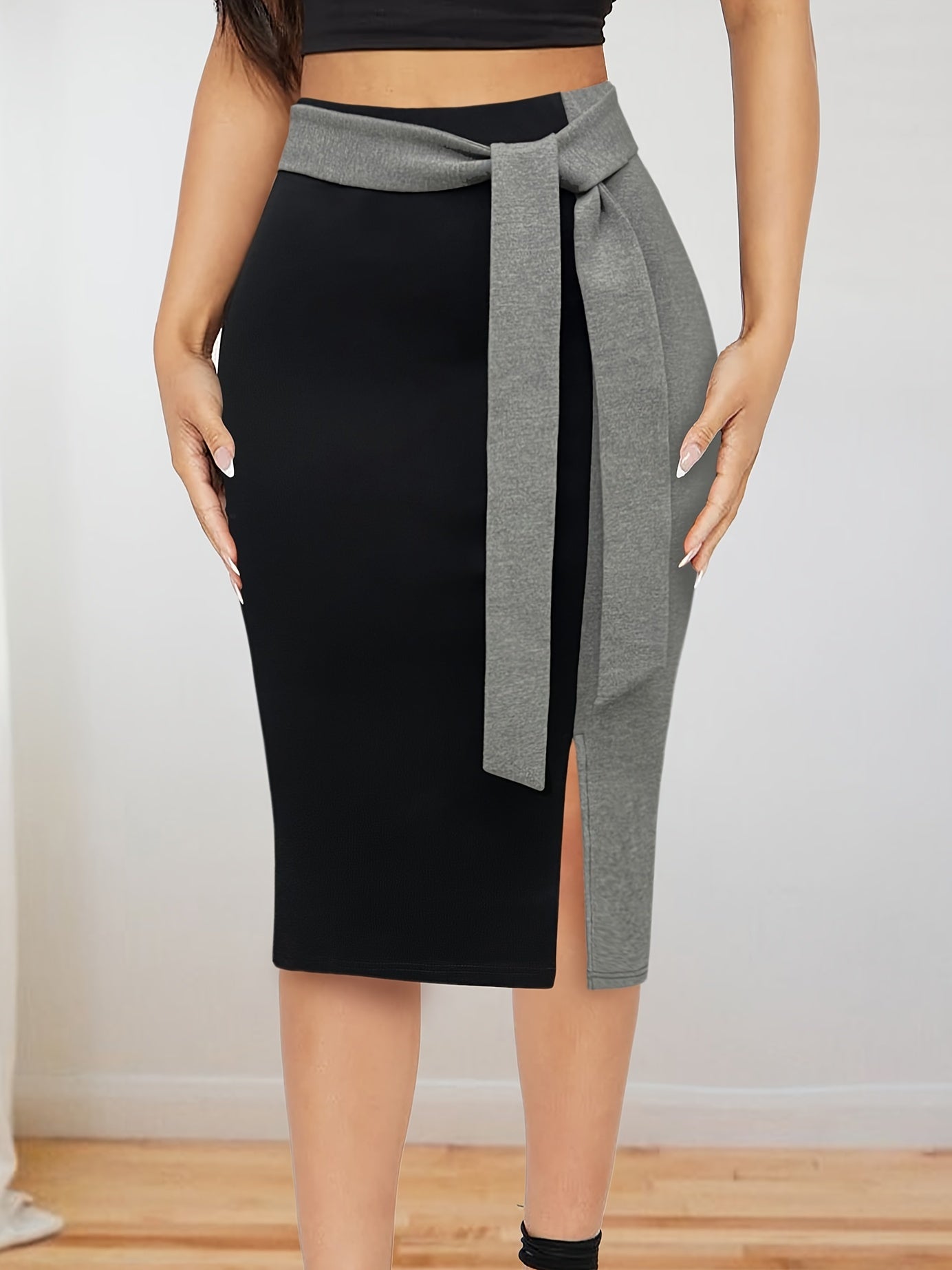 Stylish Color Block Tie-Waist Midi Skirt made of stretchy rayon blend with maroon & black design. Suitable for office or casual wear in spring/summer. Machine washable and comfortable fit.