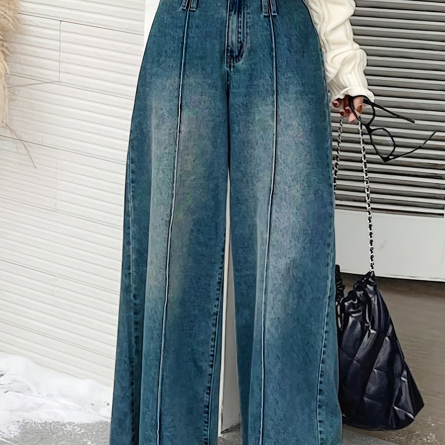 Women's wide-leg denim jeans with elastic waistband, loose fit, mid-rise, and slash pockets in light to dark blue gradient.