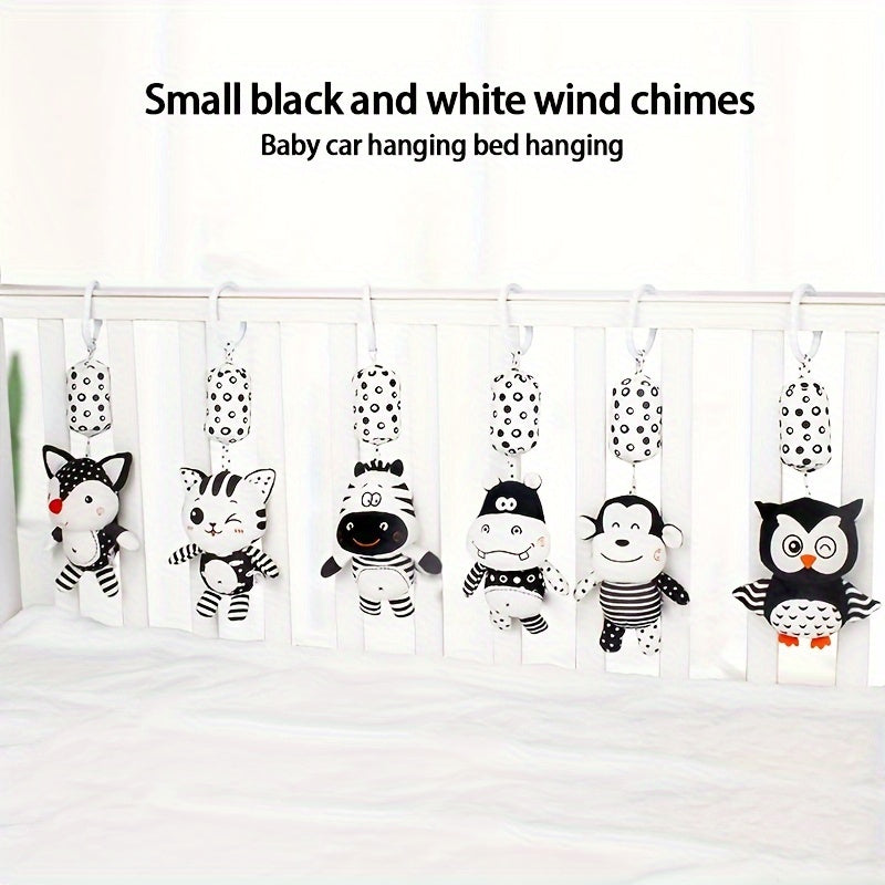 Black and white rattle wind chime for visual training in babies, perfect for early education and development. Makes a great gift for babies and toddlers.