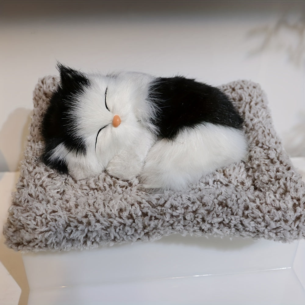 Fluffy sleeping cat figurine.