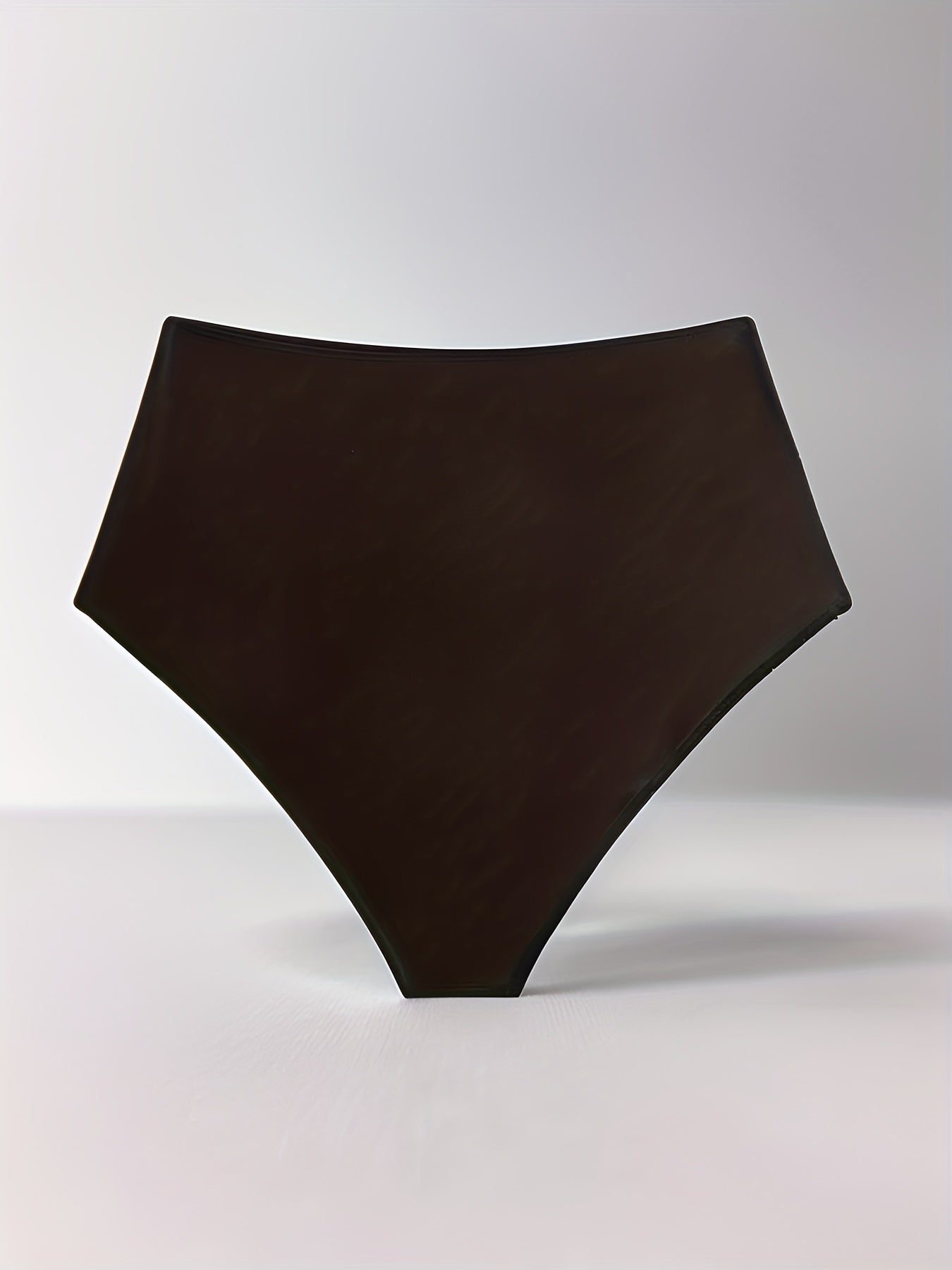 Stylish high-waisted swim bottoms for women made of a polyester and elastane blend. Features frill detail, solid color, high stretch, and knit fabric.