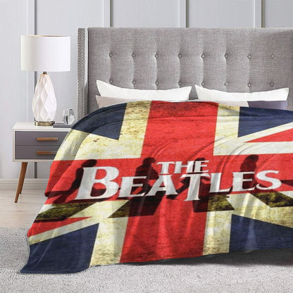 Stay warm and cozy with the ultra-soft Beatles Union Jack fleece throw blanket. Perfect for all seasons, this polyester blanket makes an ideal birthday or Christmas gift. With a contemporary style and knitted flannel in red, white, and blue, this blanket