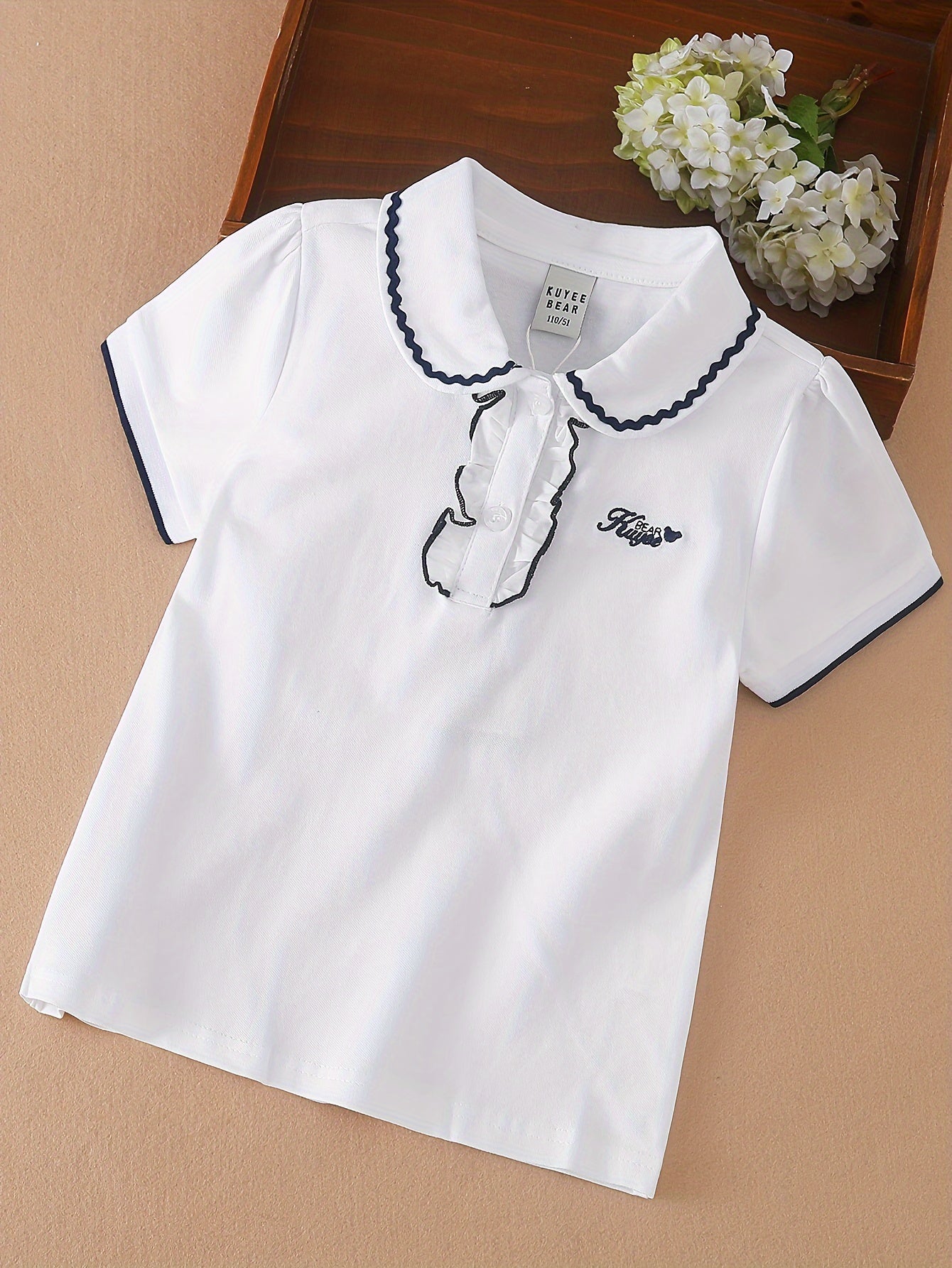 Stylish lace detail on cotton blend girls' shirt - perfect for summer casual wear.