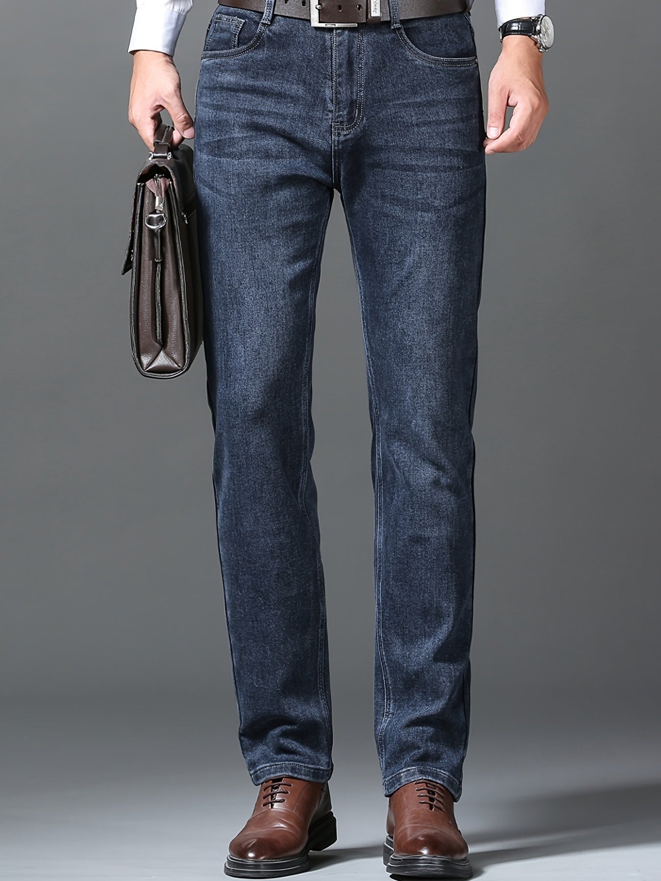 Men's semi-formal stretch denim pants with classic straight leg design and pockets, ideal for fall and winter.