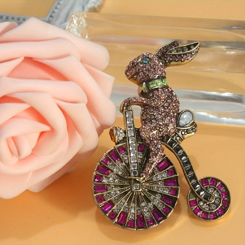 Add a touch of nostalgia with this adorable 1PC Retro Bunny Bicycle Shaped Brooch, embellished with rhinestones. A perfect accessory for women to add to their dress, coat, sweater, or corsage.