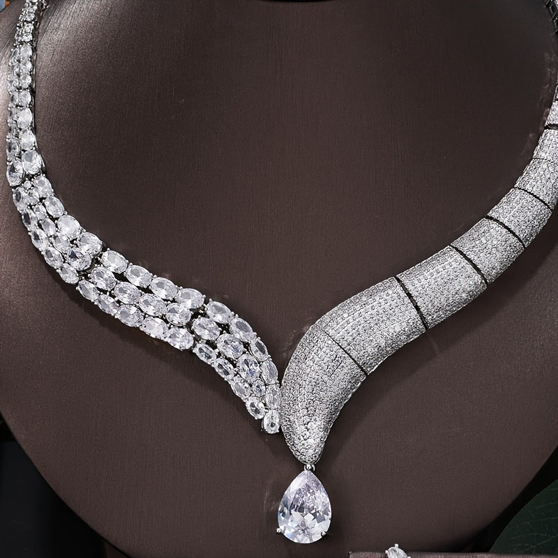 Indulge in the opulence and sophistication of this exquisite women's jewelry set, perfect for weddings, holidays, and everyday wear. This stunning ensemble includes a bracelet, necklace, ring, and earrings, each embellished with dazzling Zirstones and