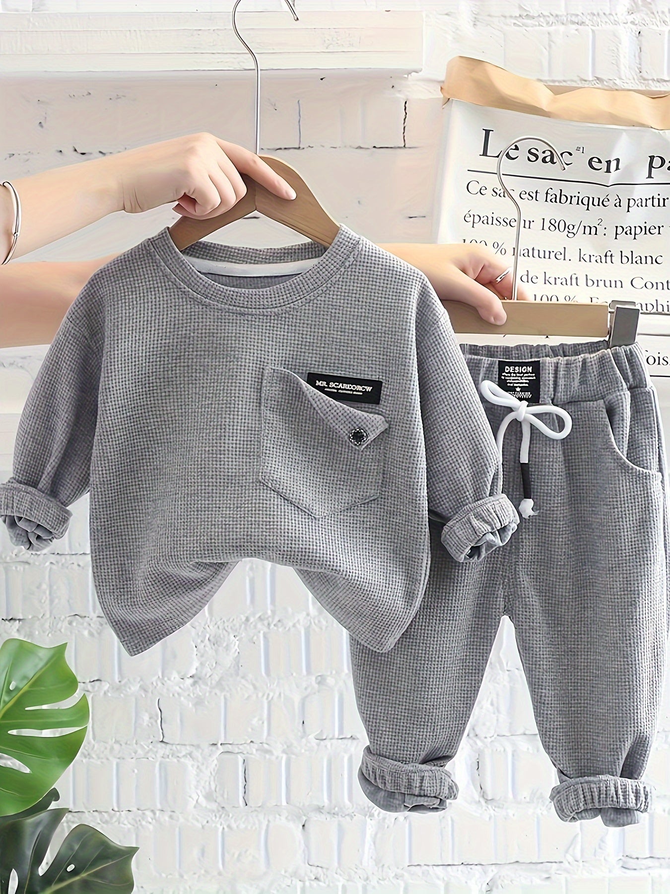 2-piece baby boy's street style set includes waffle textured long sleeve top and sporty casual pants for spring and fall outdoor wear.