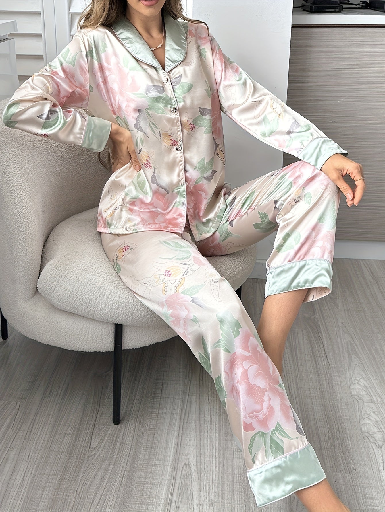 Women's soft satin pajama set with elegant floral print, long sleeve top and pants, perfect for indoor and outdoor wear.