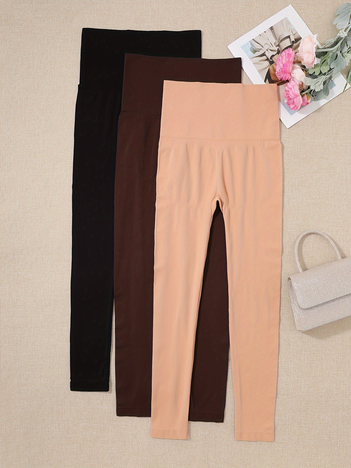 3 high waist shaping leggings for women in black, beige, and brownish-orange. Made of a lightweight, stretchy nylon/elastane blend for a slimming, comfortable fit.