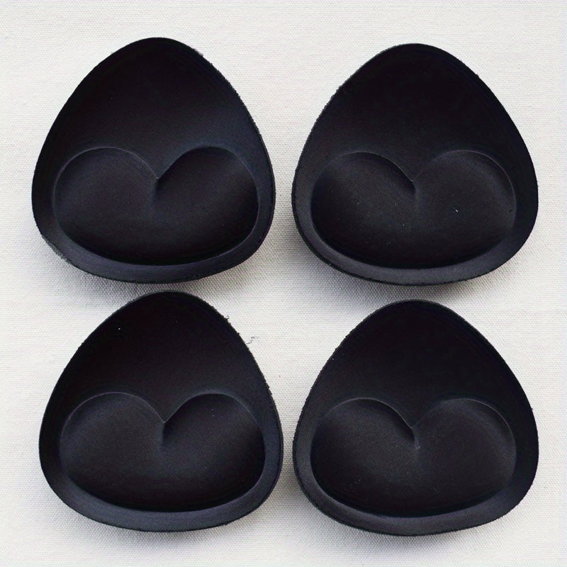 2 pairs of heart-shaped sponge bra inserts, washable and removable cup enhancers for bikinis, tops, and bras. Made from soft and breathable PU material for comfortable fit.