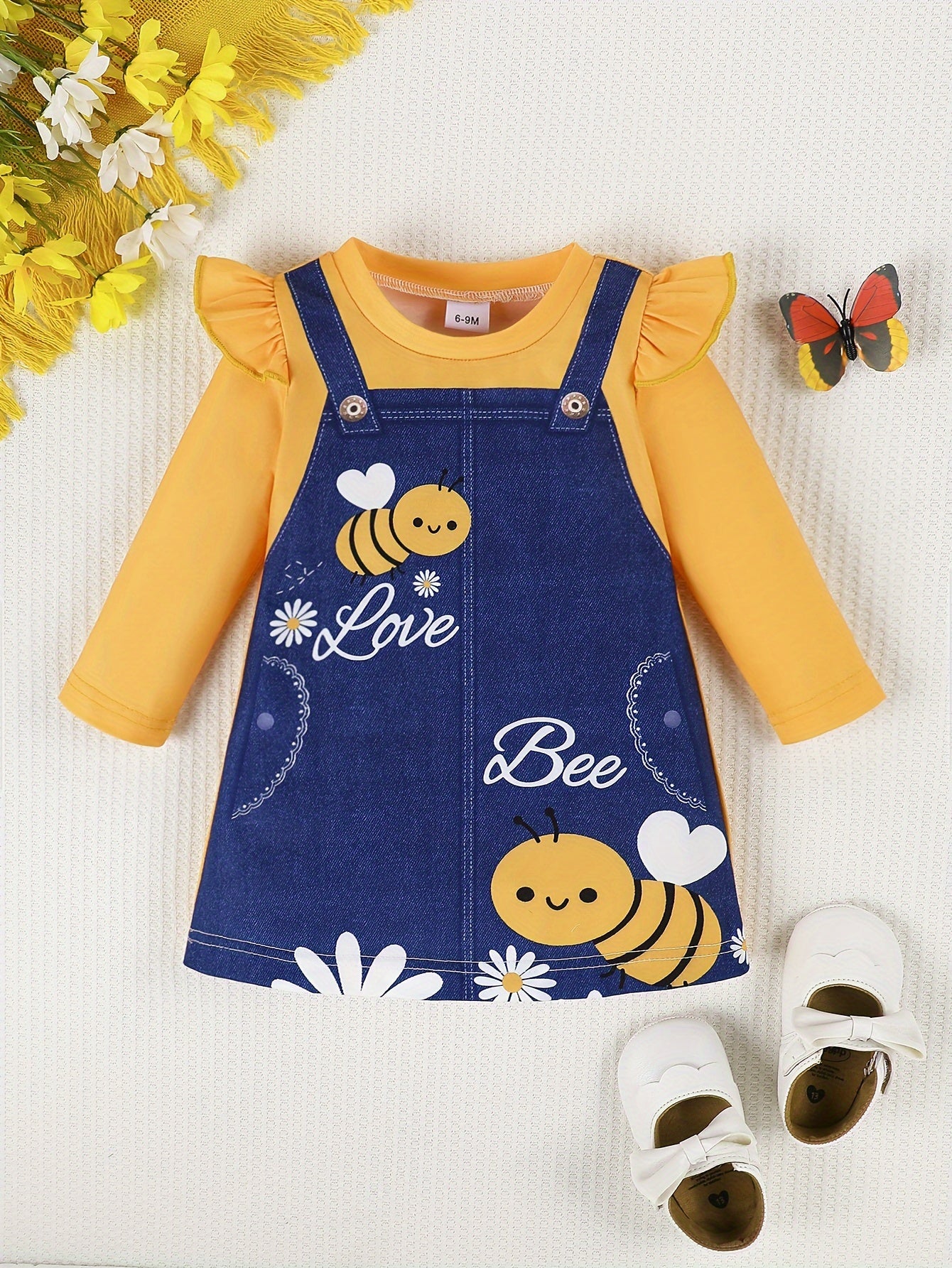 Spring dress for baby girls with lotus leaf sleeves, cute pattern, and flower bee design, both comfortable and fashionable.