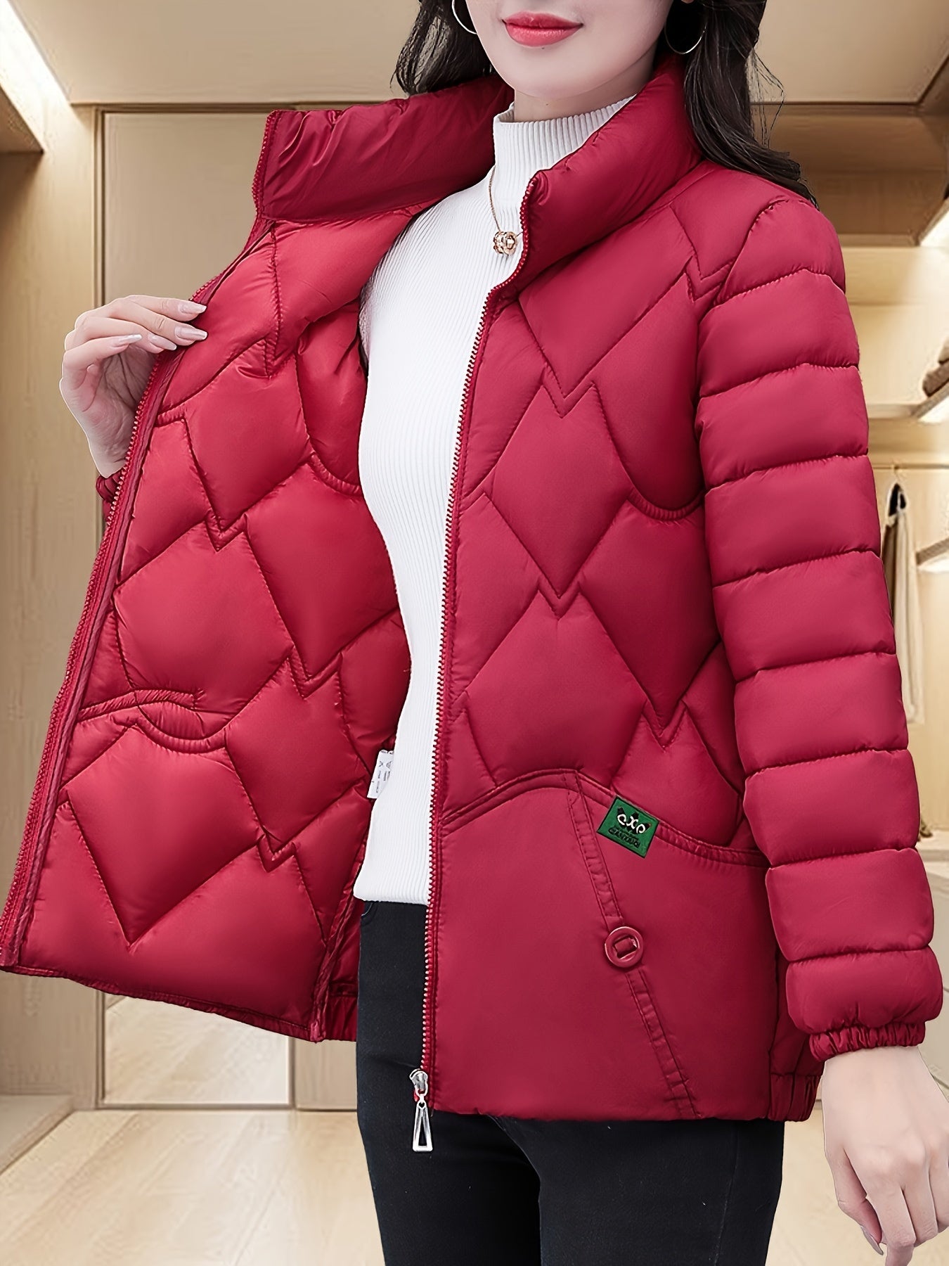 Embroidered quilted jacket for middle-aged moms with pleated hem and thick insulation for warmth.