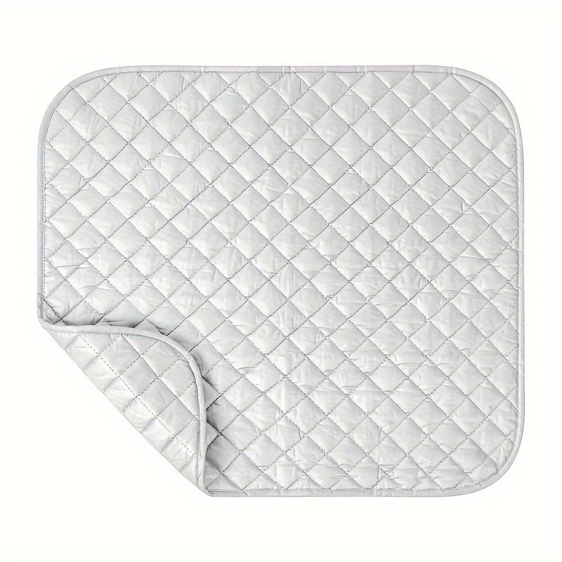 Portable Ironing Pad measuring 60.96*55.88 cm, versatile for use as an Ironing Board or Blanket. Features double-sided heat resistance, lightweight, and foldable design for easy transport. Ideal for use with washing machines, dryers, and desktops while