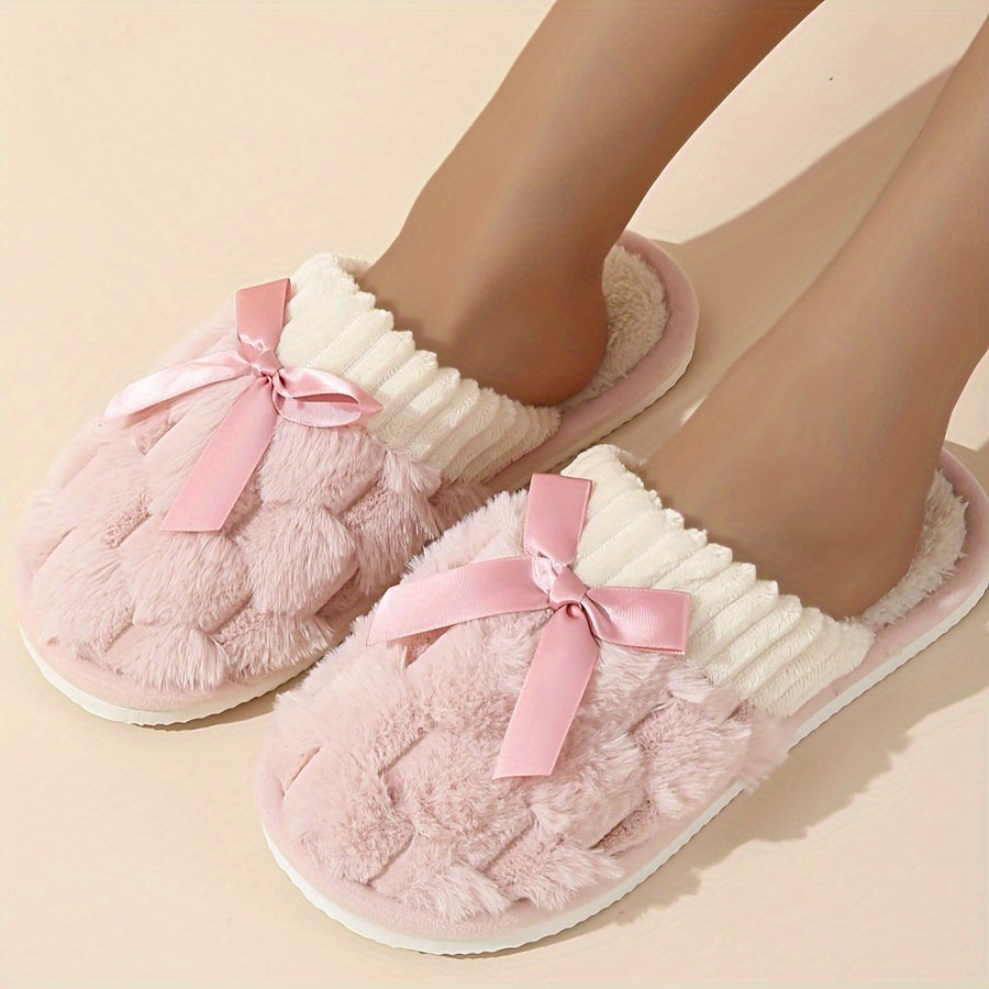 Winter plush cozy non-slip shoes with soft sole and flat bowknot decoration, ideal for home warmth.