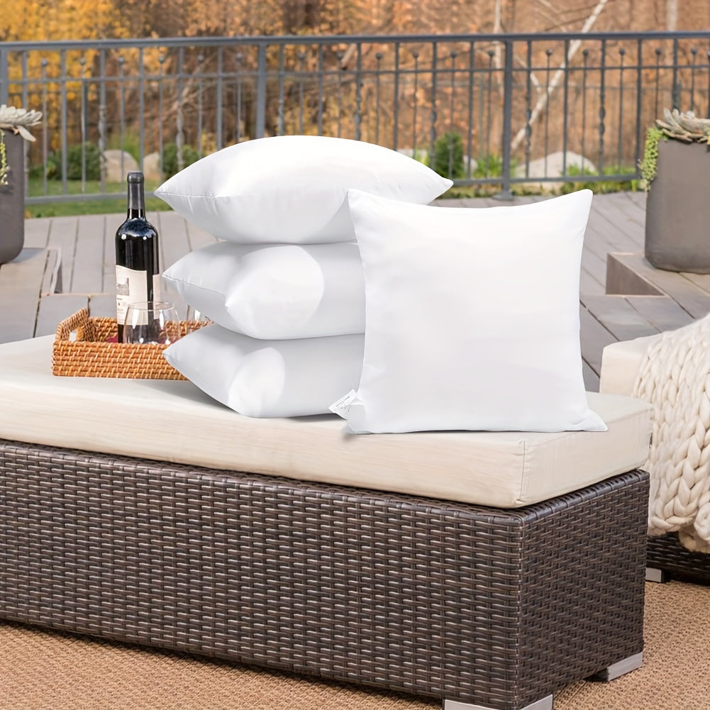 1 box of 4 waterproof outdoor throw pillow cores, white with zipper, perfect for courtyard or indoor use.