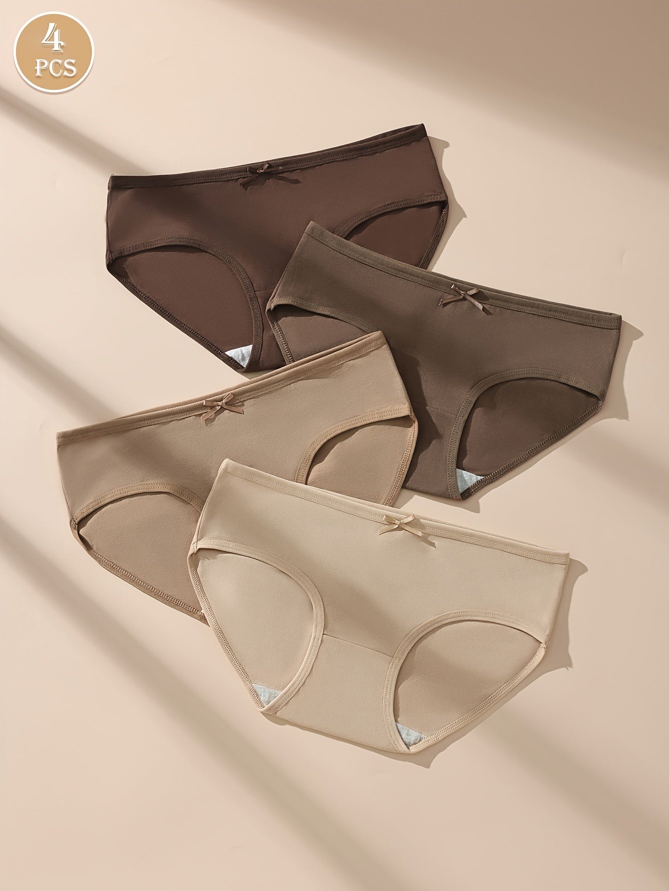 4 Maillard Color briefs for women in beige, brown, and nude shades. Sexy, comfortable, and breathable with bow detail and stretchy, non-see-through fit.