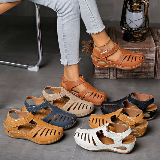 One pair of vintage-style women's platform sandals with solid color, closed toe, hook-and-loop fastener, TPR sole, and man-made materials.