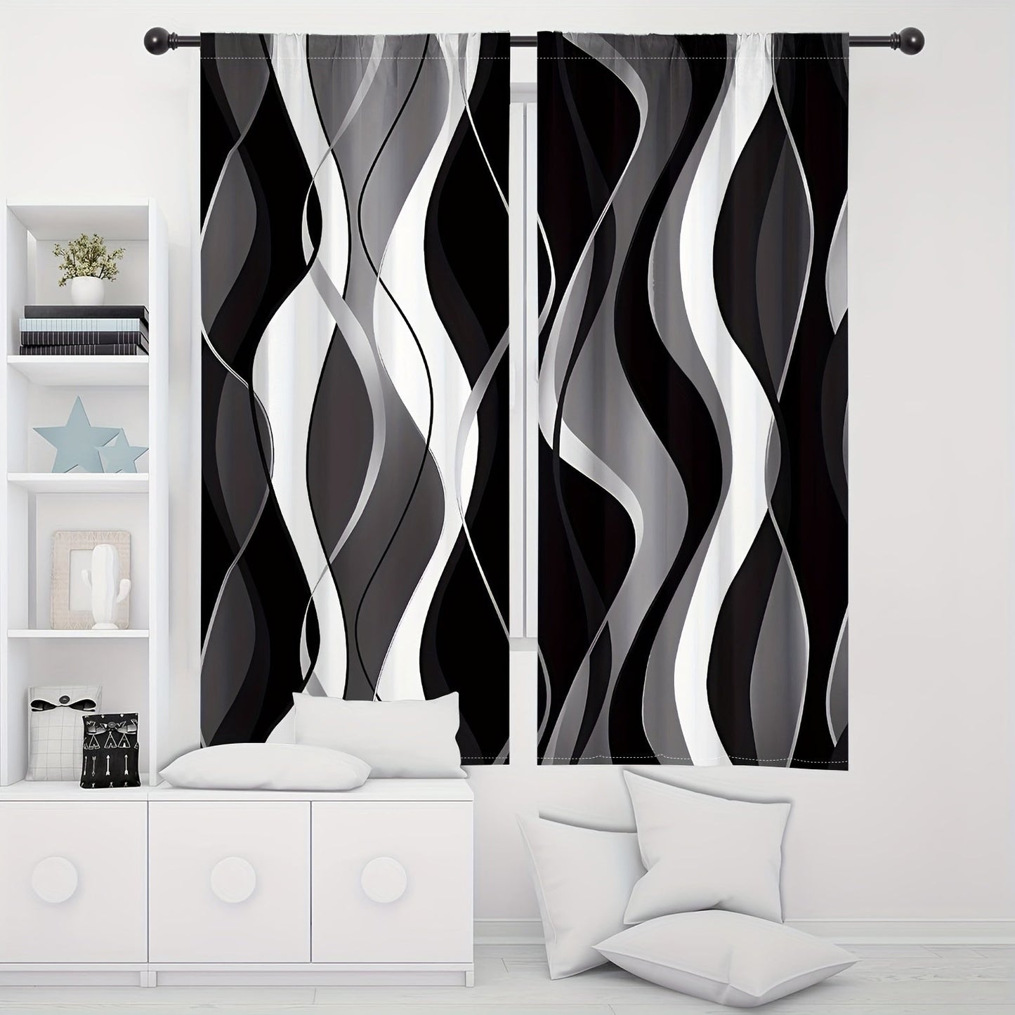 A modern abstract geometric curtain set, featuring 2 pieces in black and white. These semi-transparent privacy drapes are perfect for the living room and bedroom, and are machine washable for easy cleaning.