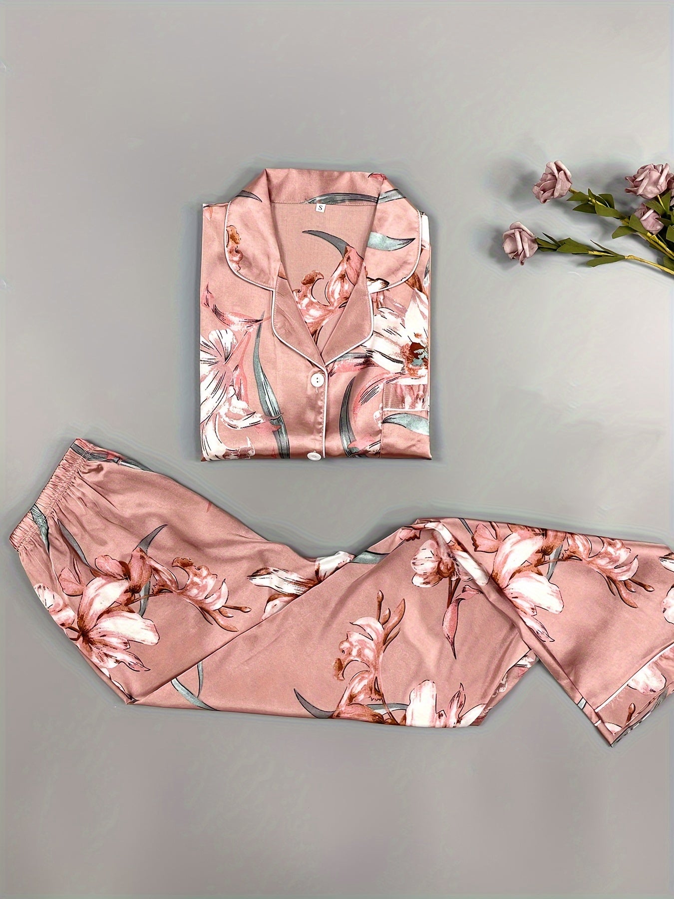 Three sets of six-piece satin pajama sets for women with printed short-sleeved buttoned cardigan tops and elastic waist trousers in a variety of colors.