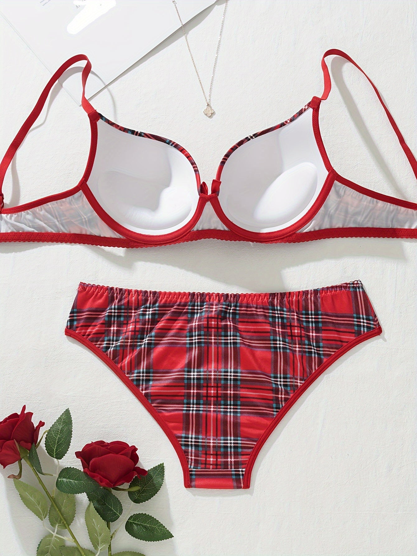 Plaid lingerie set for women made of 95% polyester and 5% elastane. Features medium support bra and mid-rise briefs in color block design. No chest pad included. Part of adult lingerie