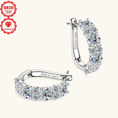 Elegant and luxurious, these hoop earrings are made of 925 sterling silver plated with synthetic moissanite stones. With a 14K golden finish, these earrings feature a total silver weight of 2.36g and are adorned with 4mm and 2mm stones totaling 1.38ctw.