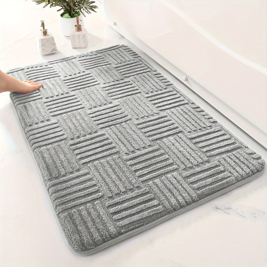 One piece of a thickened bathroom absorbent mat with a non-slip bathtub rug. Can also be used as a home entryway carpet with a solid color and stripe pattern. The mat is rectangular in shape and lightweight, machine-made with a PVC backing. Made of