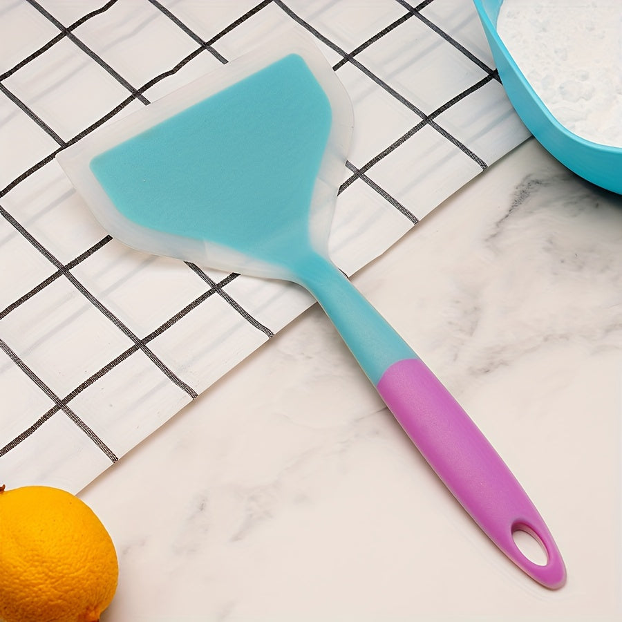 Nonstick silicone spatula turner for pancakes, eggs, fish, pizza, and steak. Heat-resistant and wide for easy flipping. Kitchen utensil accessory.