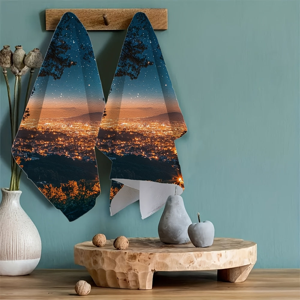 Two Coastal Style Kitchen Towels made of super absorbent polyester knit fabric. These contemporary oblong hand towels feature a sparkling city night view and are machine washable. Each towel measures 40.64x60.96 cm.