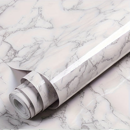 Roll of waterproof adhesive film with a marble pattern that is resistant to heat and oil. Ideal for lining kitchen and bathroom cabinets, drawers, and furniture during renovations. This non-food contact home decor solution is perfect for adding a touch