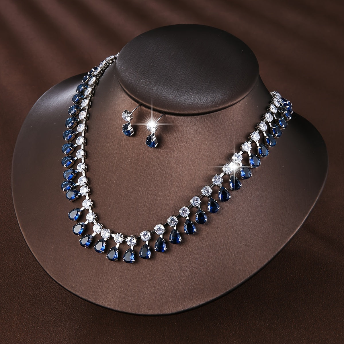 New European and American style set of three elegant jewelry pieces for ladies, including earrings and necklace adorned with luxurious zirconia. Perfect for bridal wedding events or formal banquets, this set is both fashionable and chic.