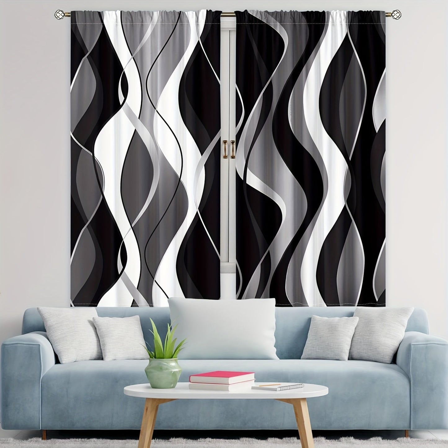 A modern abstract geometric curtain set, featuring 2 pieces in black and white. These semi-transparent privacy drapes are perfect for the living room and bedroom, and are machine washable for easy cleaning.