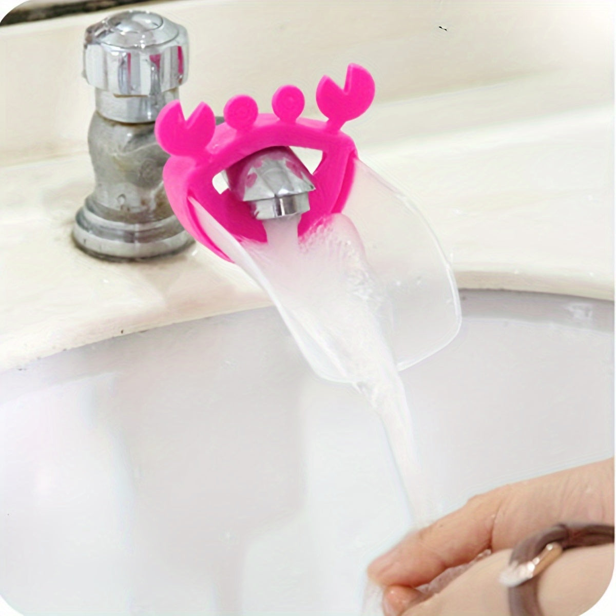 Crab-shaped water spout for kids makes hand washing fun with cartoon design.