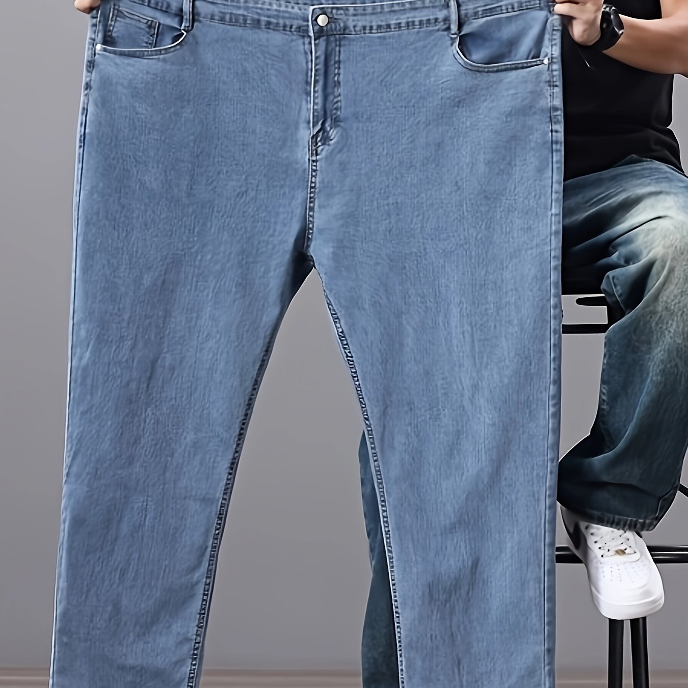 Men's high-waisted denim jeans with stretch fit in a solid color. Features regular fit, straight leg, and made of 45% cotton, 33% polyester, 1.5% spandex, 20.5% rayon. Lightweight at