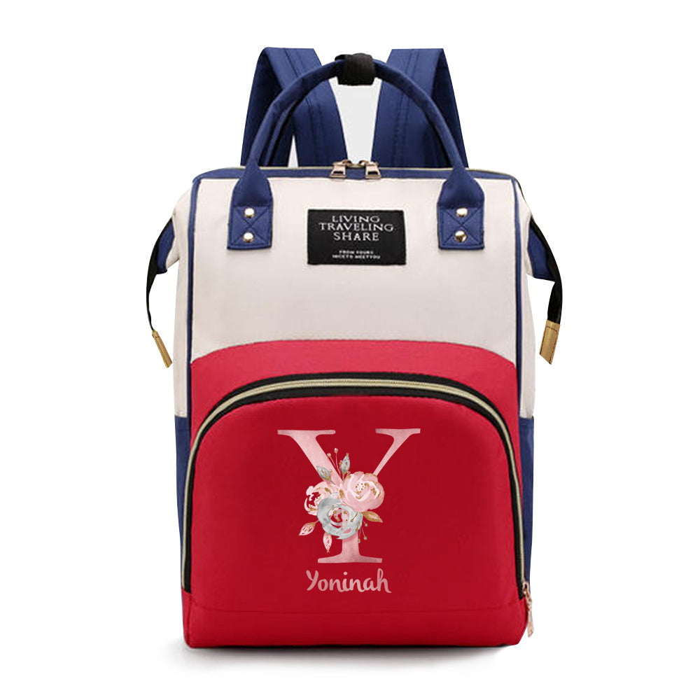 Personalized Mommy Backpack made of durable Oxford cloth with ample storage space for diapers and other essentials. Features customizable initials and name, as well as convenient bottle pockets. Perfect for nursing mothers on-the-go, with options for A-Z