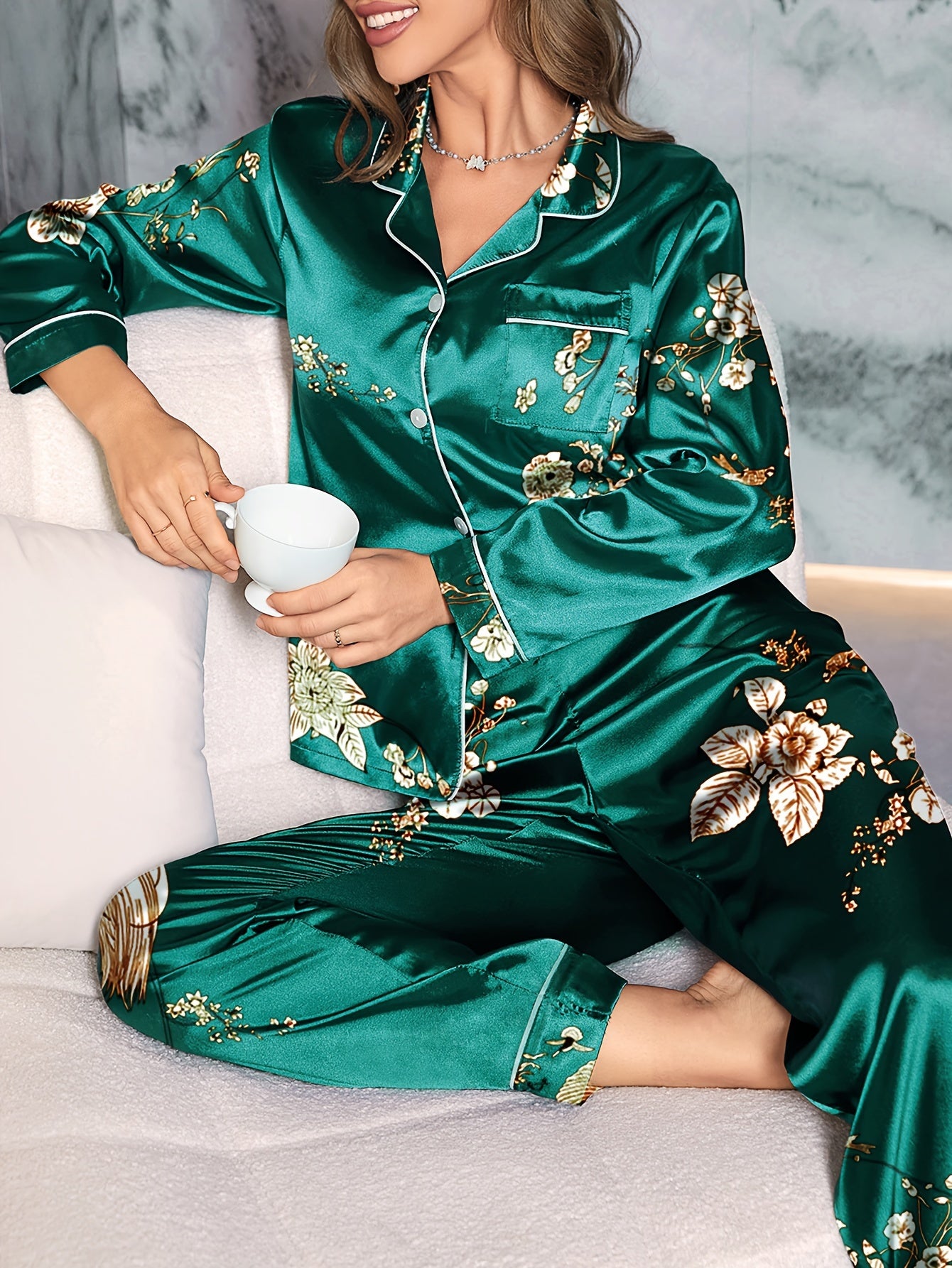 Floral satin pajama set for women, featuring long sleeve top with lapel buttons and matching pants, perfect for a cozy fall look.